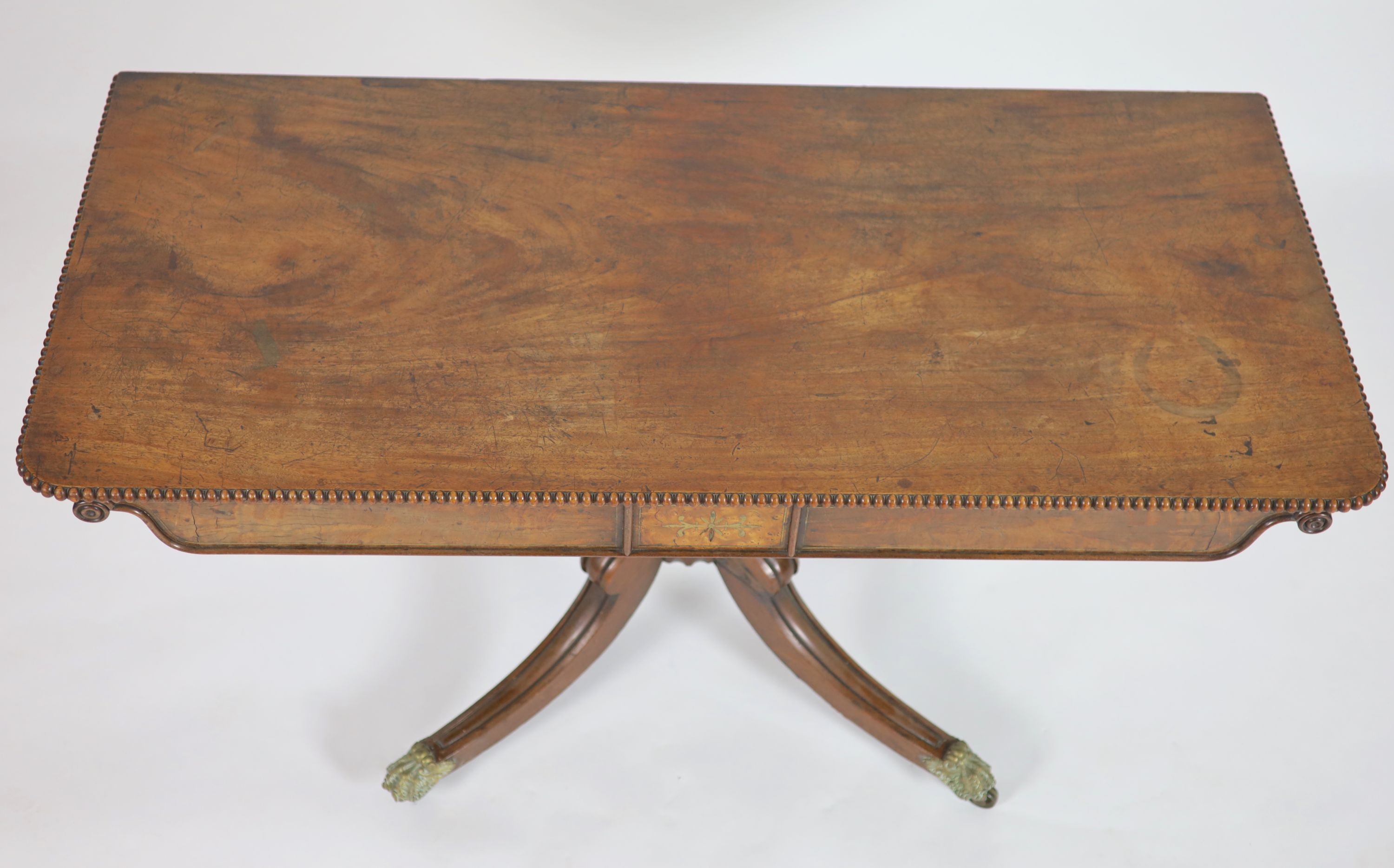 A Regency brass inlaid rectangular mahogany side table, length 136cm, depth 62cm, height 57cm